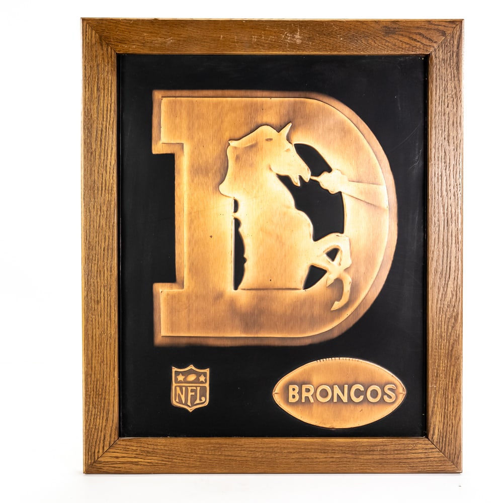 1960s Denver Broncos Acrometal Vintage NFL Plaque: 1960s Denver Bronco's Acrometal framed vintage NFL wall plaque. Presents well and is perfectly accented in a 23" t x 19"l solid wood frame. Very good overall condition with minimal signs of age and we