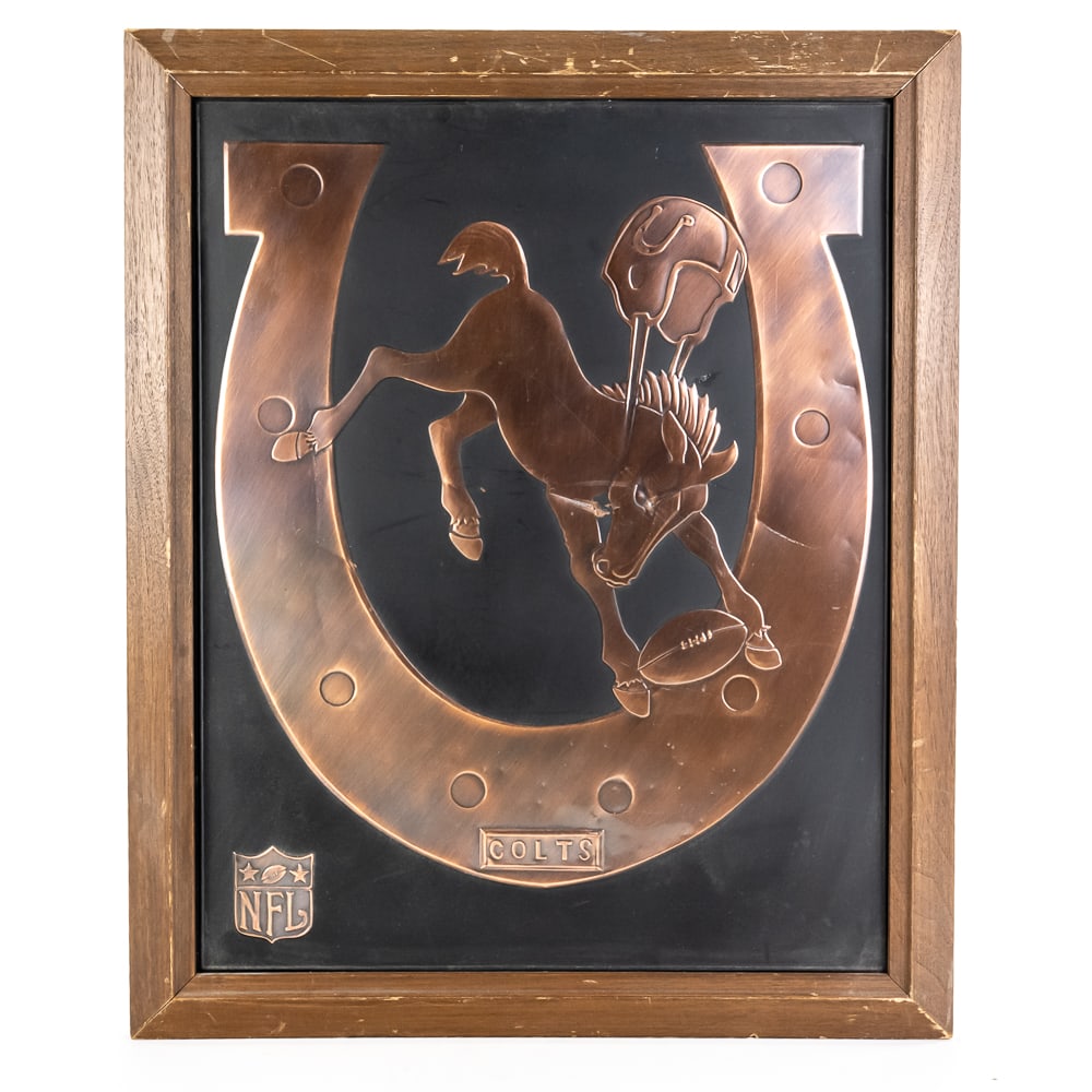1960s INDY Colt's Acrometal Vintage NFL Plaque: 1960s Indianapolis Colts Acrometal framed vintage NFL wall plaque. Presents well and is perfectly accented in a 23" t x 19"l solid wood frame. Very good overall condition with some signs of age and we