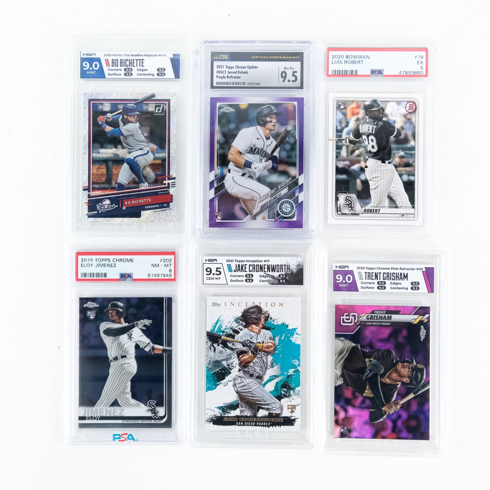 MLB Slabbed Card Assortment 20 Bichette RC Rapture: Collection features 2020 Panini The Rookies Rapture #R-6 HGA 9, 2020 Bowman Luis Robert #18 PSA 5, 2021 Topps Chrome Update #USC2 Jared Kelenic Purple Refractor CSG 9.5, 2020 Topps Chrome Pink Refract