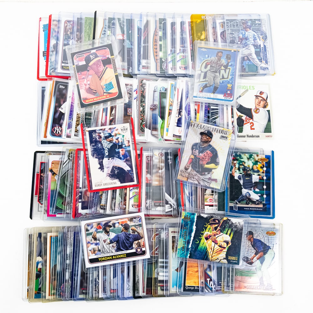 (150) Assorted MLB Baseball Cards RCs & More +: Collection features (150) assorted MLB including Rookies, Refractors, & Stars & "Up and comer's". Each is EX-MT +/- and showcased inside either an penny sleeve or top loader. Hours of fun with submiss
