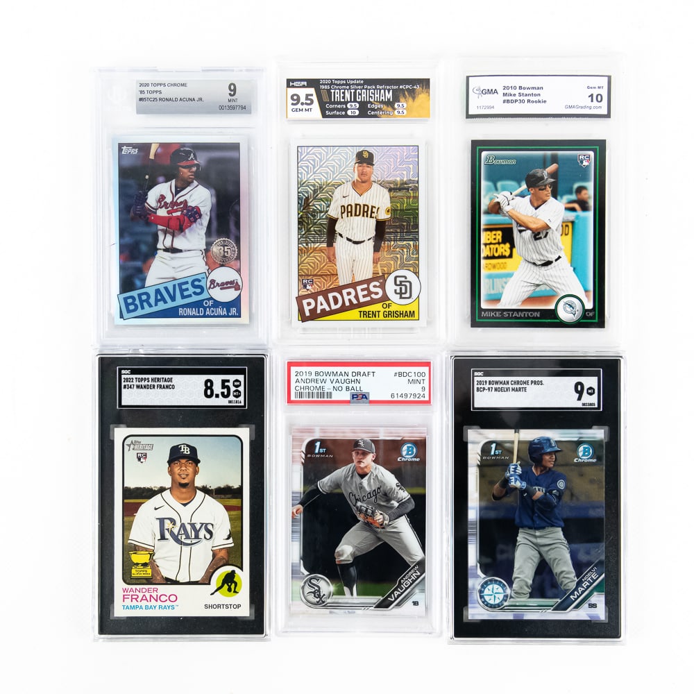 MLB Slab Assortment 22 Topps Wander Franco Grisham: Collection features 2019 Topps Heritage #347 Wander Franco SGC 8.5, 2020 Topps Update 1985 Silver Pack Refractor #CPC-43 HGA 9.5, 2020 Topps Chrome '85 Topps #85TC25 Ronald Acuna Jr Beckett 9, 2010 Bo