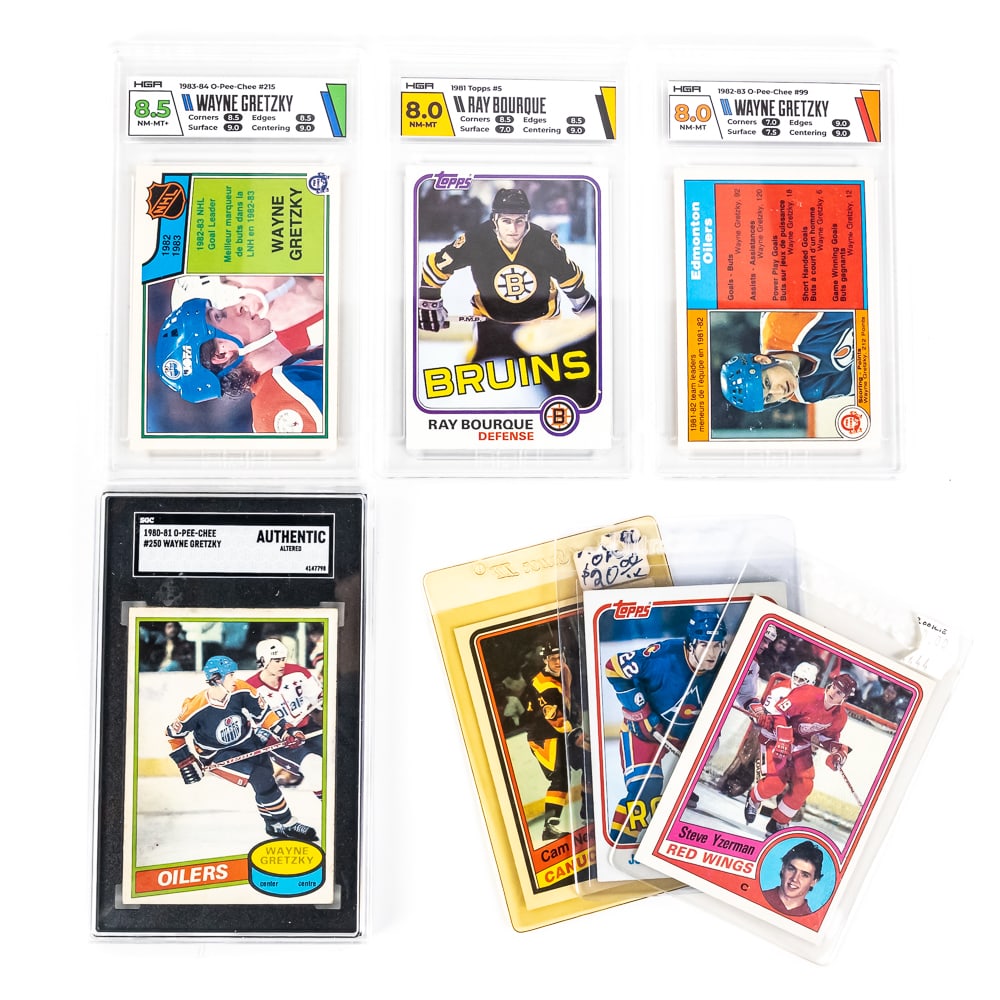 1980 O Pee Chee Wayne Gretzky Cam Neeley Yzerman++: Collection showcases 1980-1981 O Pee Chee #250 Wayne Gretzky SGC Authentic,1982-83 O Pee Chee #99 Wayne Gretzky HGA 8, 1983 O Pee Chee #215 Wayne Gretzky HGA 8.5, 1981 Topps #5 Ray Bourque HGA 8, 1984