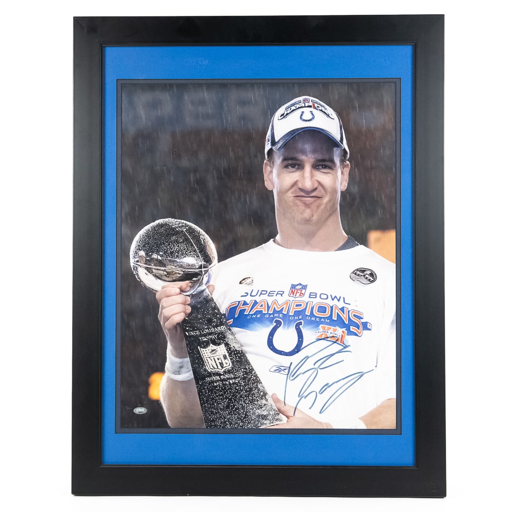 Peyton Manning Signed Auto Framed Photo w COA: Peyton Manning signed autographed 16" x 20" photo with Peyton holding the Lombardi Trophy at Super bowl XLI (Ind. vs Chi). Very good overall condition, presents extremely well being professionally fra