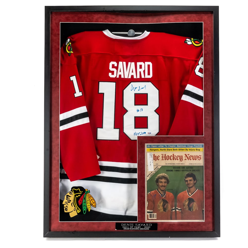 Denis Savard AUTO Blackhawks Jersey Display PSA +: Denis Savard AUTOGRAPHED Chicago Blackhawks Jersey showcased inside an attractive custom shadow box display. Hanging Jersey is presented perfectly within the Blackhawks Red boarder perfectly matched