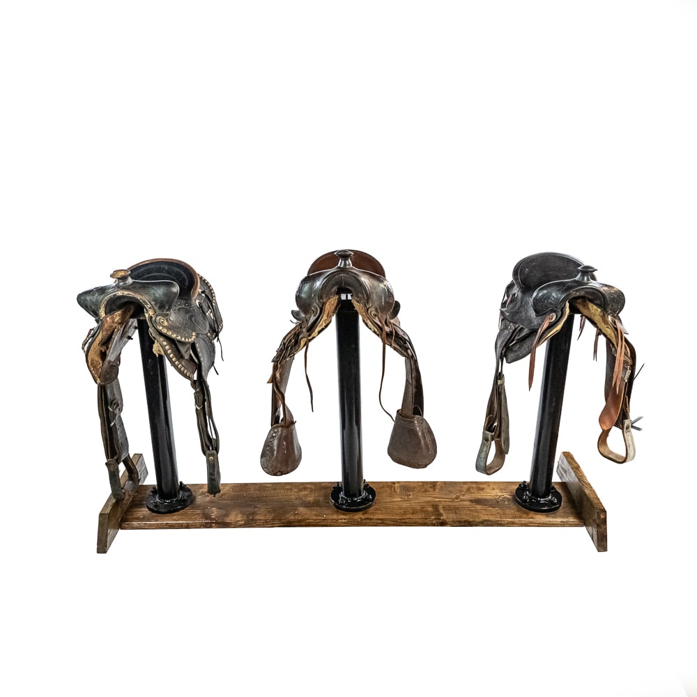 Donley's Wild West Town Saddle Bar Stools (3): This is an incredible piece of amusement park history: a set of three saddle bar stools with their custom wooden stand, all sourced directly from the Sarsaparilla Saloon at Donley's Wild West Town in