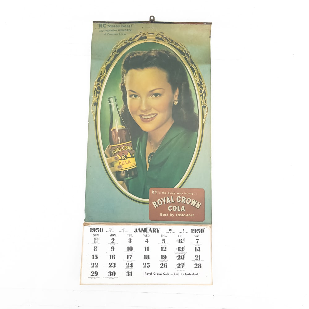 Vintage Royal Crown Cola 1950 Calendar: Vintage Royal Crown Cola 1950 Calendar features actress Wanda Hendrix in a portrait, includes tag line "Best by taste-test", retains all 12 months, slightly worn along edges, overall good condition,