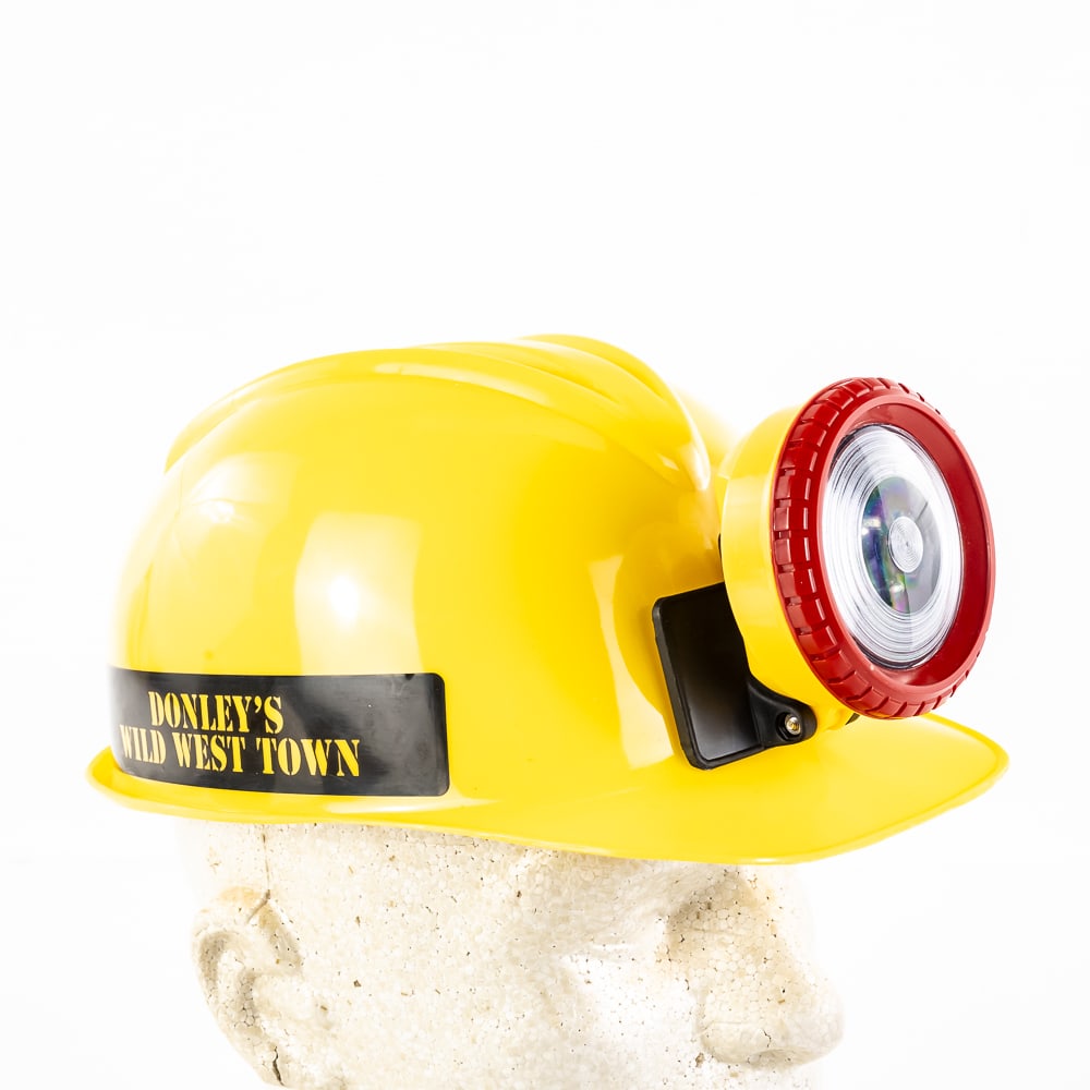 Toy Miner's Yellow Helmet from Donley's WWT: Toy Miner's Helmet - Yellow, new old stock, from Donley's Wild Town's Rock Shop, features a built-in imitation light on the front, needs batteries, see photos.Here is your chance to own a piece of his