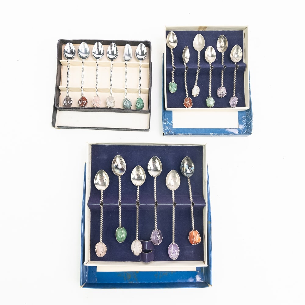 (3) Semi Precious Stone Demitasse Spoon Sets: Collection of (3) complete boxed sets of demitasse spoon sets; each perfectly accented with semi precious stones. The smallest set stands 3.5", the middle set stands 4" and the tallest set stand 4.5"