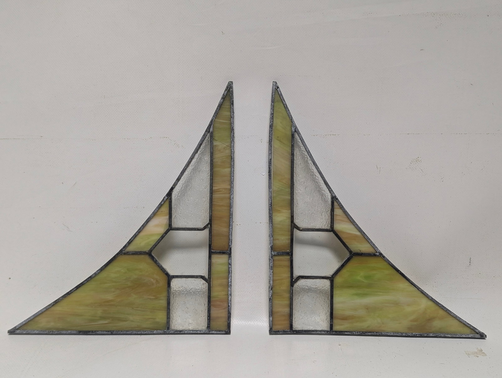 Leaded Glass Corners For A Seeburg KT Nickelodeon: 2 corner leaded glass pieces for a KT front. Need some repair (see pics). As photographed, the left piece has a slight crack near the top and the right piece, the metal caming is pulling away from the