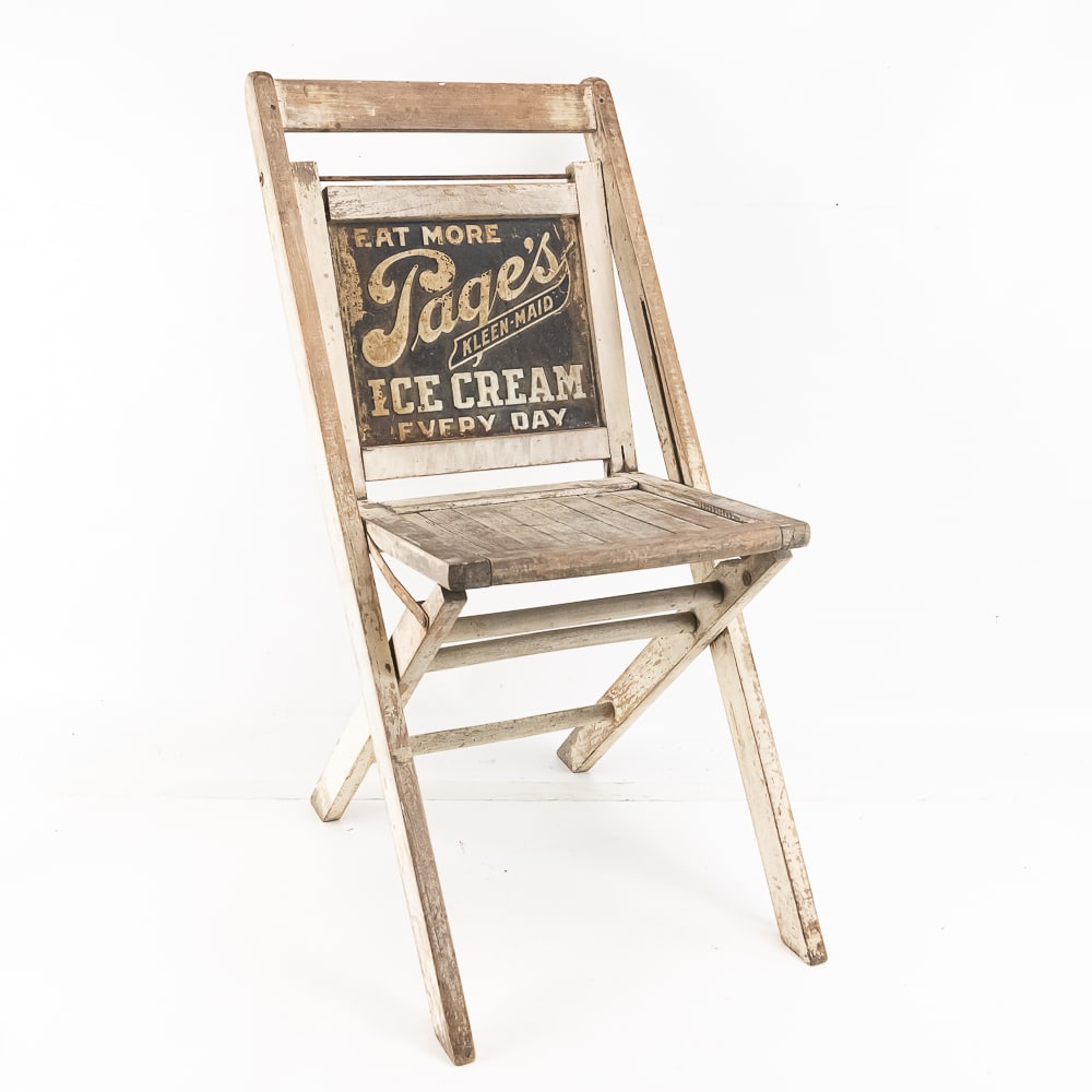 Pages Keen Maid Ice Cream Advertising Chair: A wood folding, deck style chair has an embossed tin sign for the back rest advertising Page ice cream. Item shows some wear. It is complete and folds. Please see photos.20" L x 16" W x 33" H
