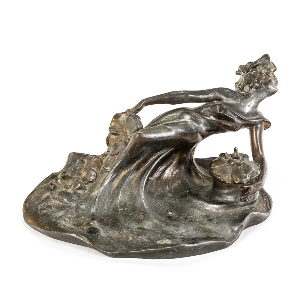 Art Nouveau Metal Inkwell by L. Alliot: This antique Art Nouveau inkwell is a signed work by the French sculptor Lucien Charles Edouard Alliot (1877–1967). The piece features a classic "Femme-Fleur" motif, with a woman in flowing drapery 