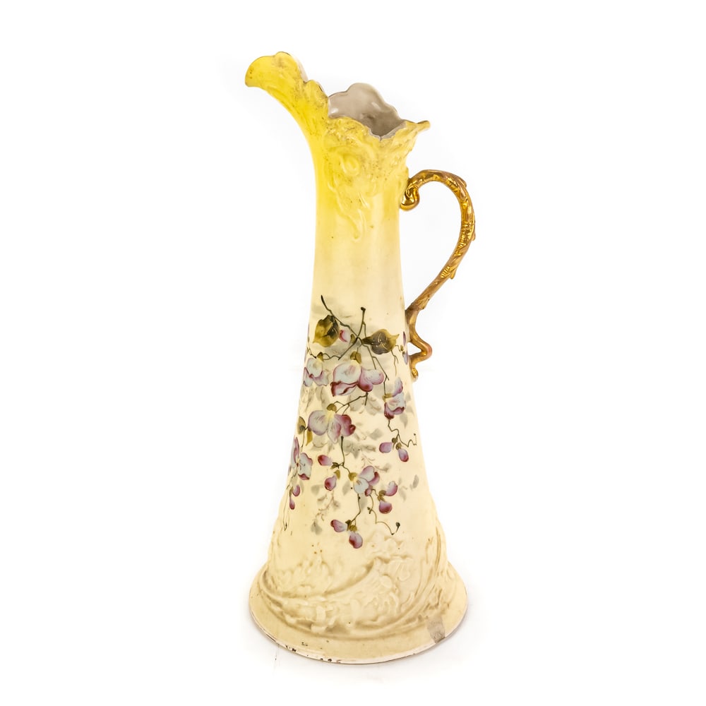 Antique G&G Teplitz Austria Porcelain Pitcher: Antique G&G Teplitz Austria Porcelain Pitcher, features a ruffled, scalloped rim, an ornate handle, hand-painted floral motif, gold gilding on a "blush ivory" background, small chip in top rim, minor