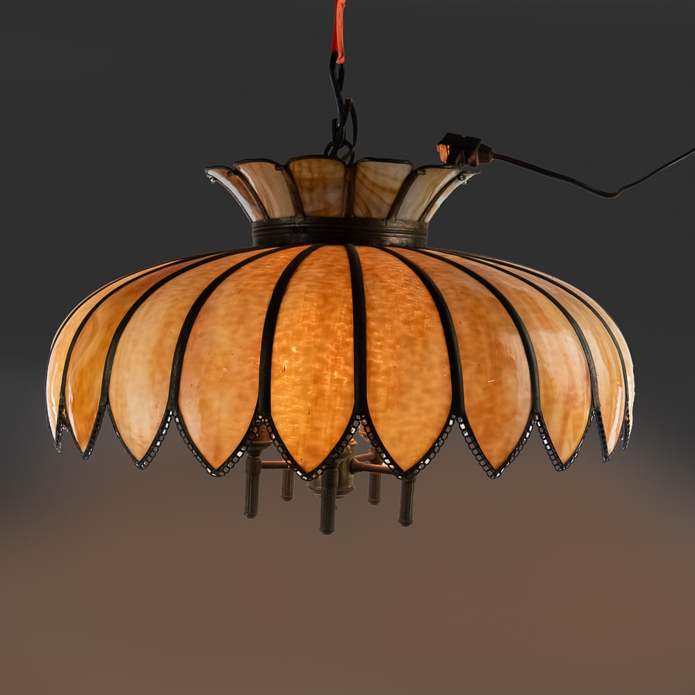 Tiffany-Style Slag Glass Hanging Lamp: Tiffany-Style Slag Glass Hanging Lamp, vintage lotus swag lamp featuring a tulip-shaped shade made of warm honey-colored glass panels, held in a metal frame, no cracks in glass panels, has five light 