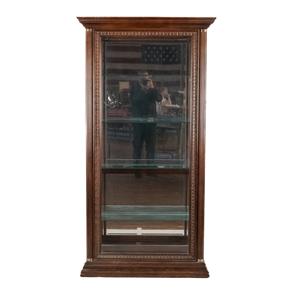 Lighted Curio Cabinet: Contemporary but well made tall curio cabinet / showcase. Solid mahogany case has fluted columns on the front corners, a cornice top, beveled glass front, mirror back, glass entry doors on both