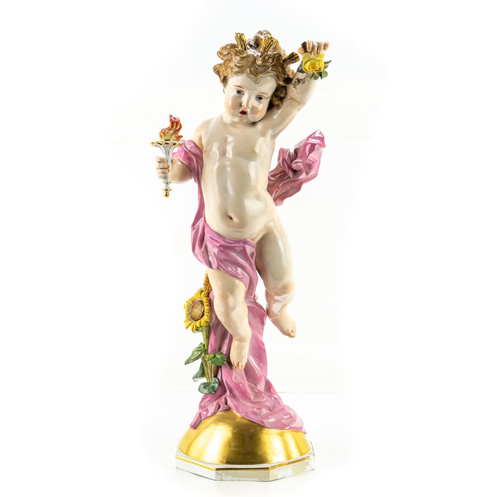 Meissen "Day" Porcelain Figurine: Meissen "Day" Porcelain Figurine, designed by Heinrich Schwabe around 1877-1880, cherub holding a flaming torch and a sunflower, adorned with a pink robe, blue crossed swords mark on bottom, sunflower