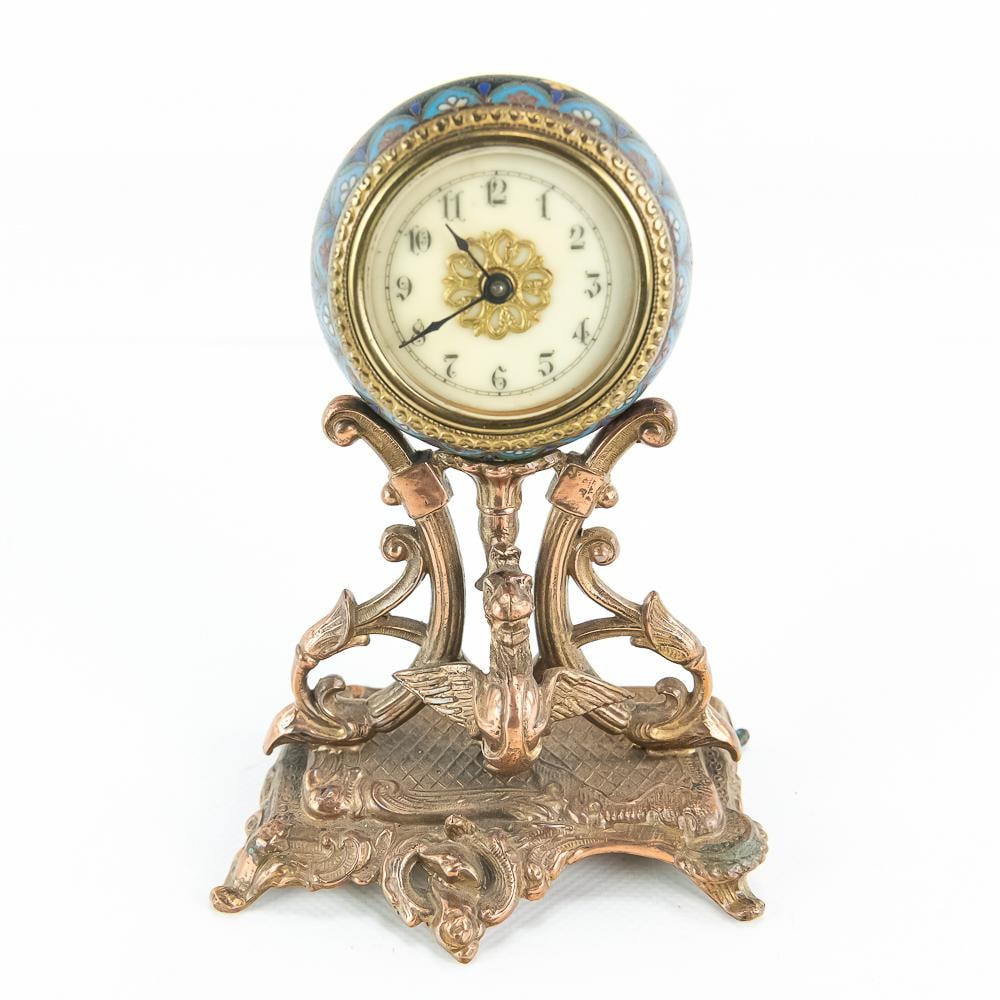 Antique Cloisonné & Bronze Desk Clock: This exquisite late 19th-century desk clock features a vibrant cloisonné enamel orb body decorated with floral motifs, supported by a highly ornate cast bronze base showcasing a winged griffin or