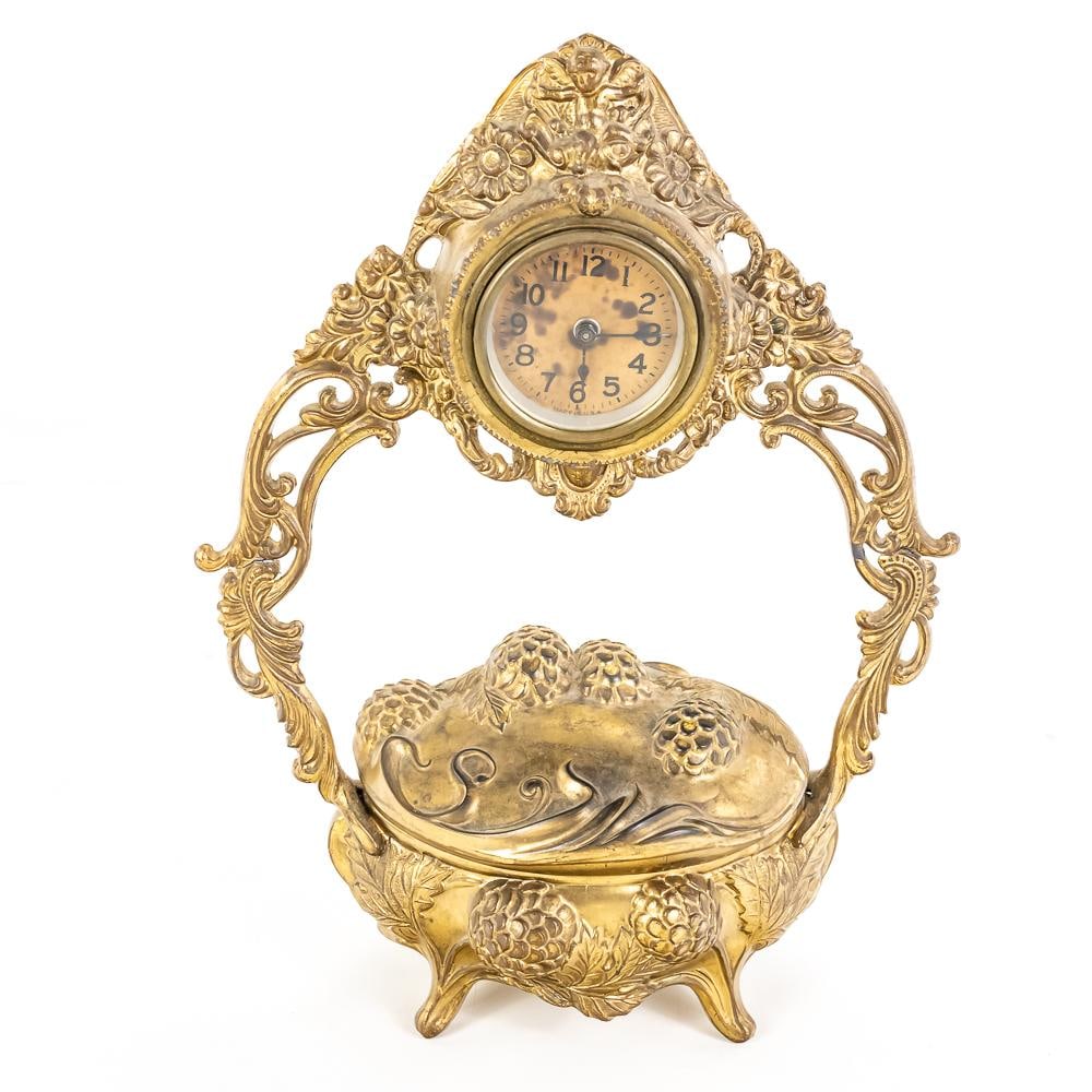 Antique Gilt Cast Metal Jewelry Box Clock: This is a charming example of late 19th to early 20th-century decorative functional art, likely of American origin given the "Made in U.S.A." marking visible on the lower dial. The piece features an o