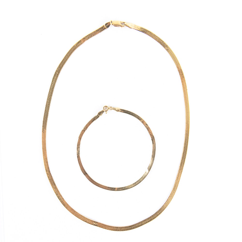 14k Ladies Herringbone 16" Necklace & 7.5 Bracelet: Lovely collection showcases an impressive 14k yellow gold Herringbone ladies 16" necklace perfectly paired with 14k yellow gold Herringbone ladies 7.5" bracelet. Presents well with minimal signs of ag
