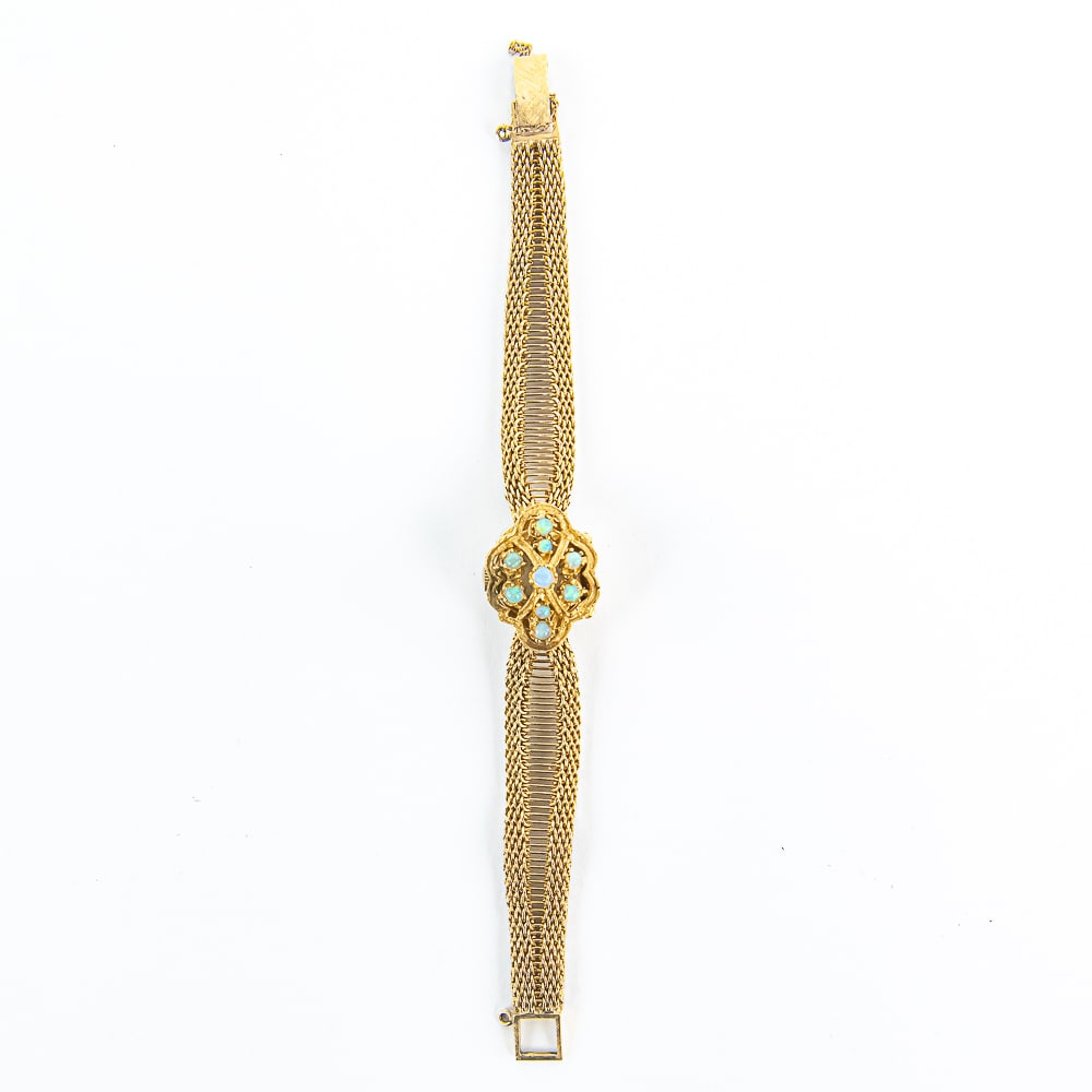 Ladies 14k Opal Accented Hidden Geneva Watch: Vintage ladies 14k Opal Accented hidden wristwatch. A Real Eye Catcher !!! Striking case is embellished with (9) attractive Opals, which really "POP" out on handsome well constructed 14k yellow gold s