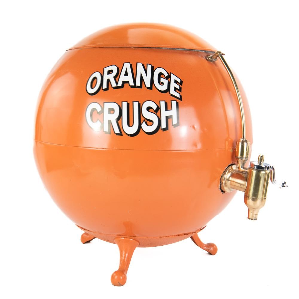 Diner/Cafe Orange Crush Counter Dispenser: Figural counter soda dispenser with a nicely polished spigot, original lid, older restoration, all sitting on three unique legs. A little surface rust inside and a few light dings and scratches on ext