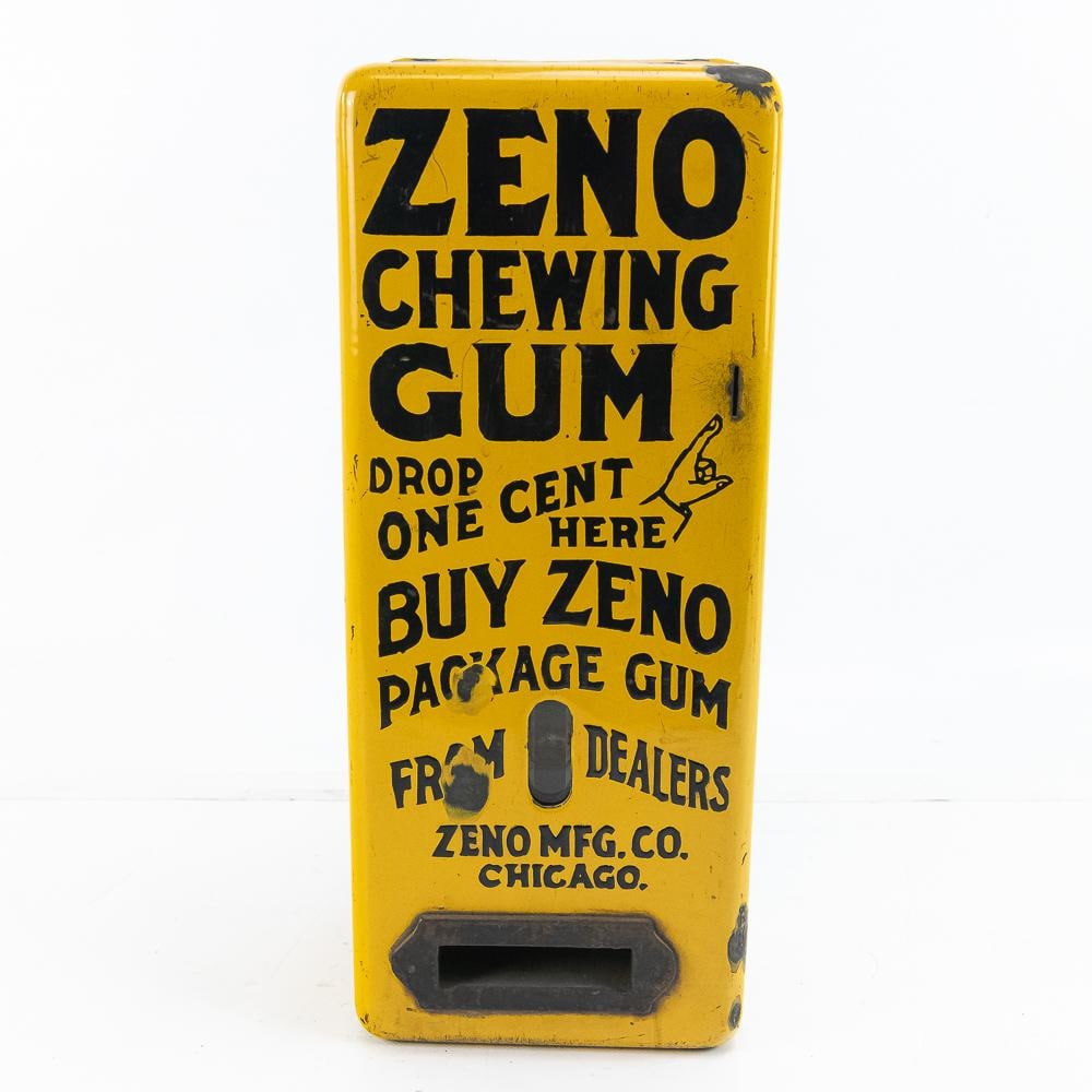 Yellow Porcelain Zeno Gum Vending Machine: A very early metal body, porcelain gum machine that has the clock wound mechanism, Looks to be fairly complete and in good condition with just a couple porcelain chips. These machines were loaded with