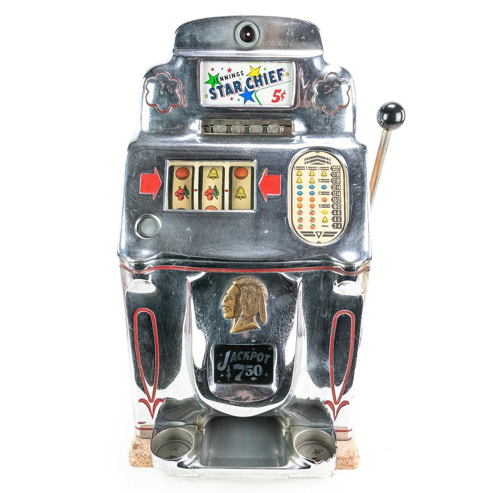 Jennings 5 Cent "Star Chief" Slot Machine: A 3 reel, front jackpot, 5 cent slot. Machine in good original condition with wood case and original back door painted. Has some coins inside, coin box, lock and key. This one has the casino front