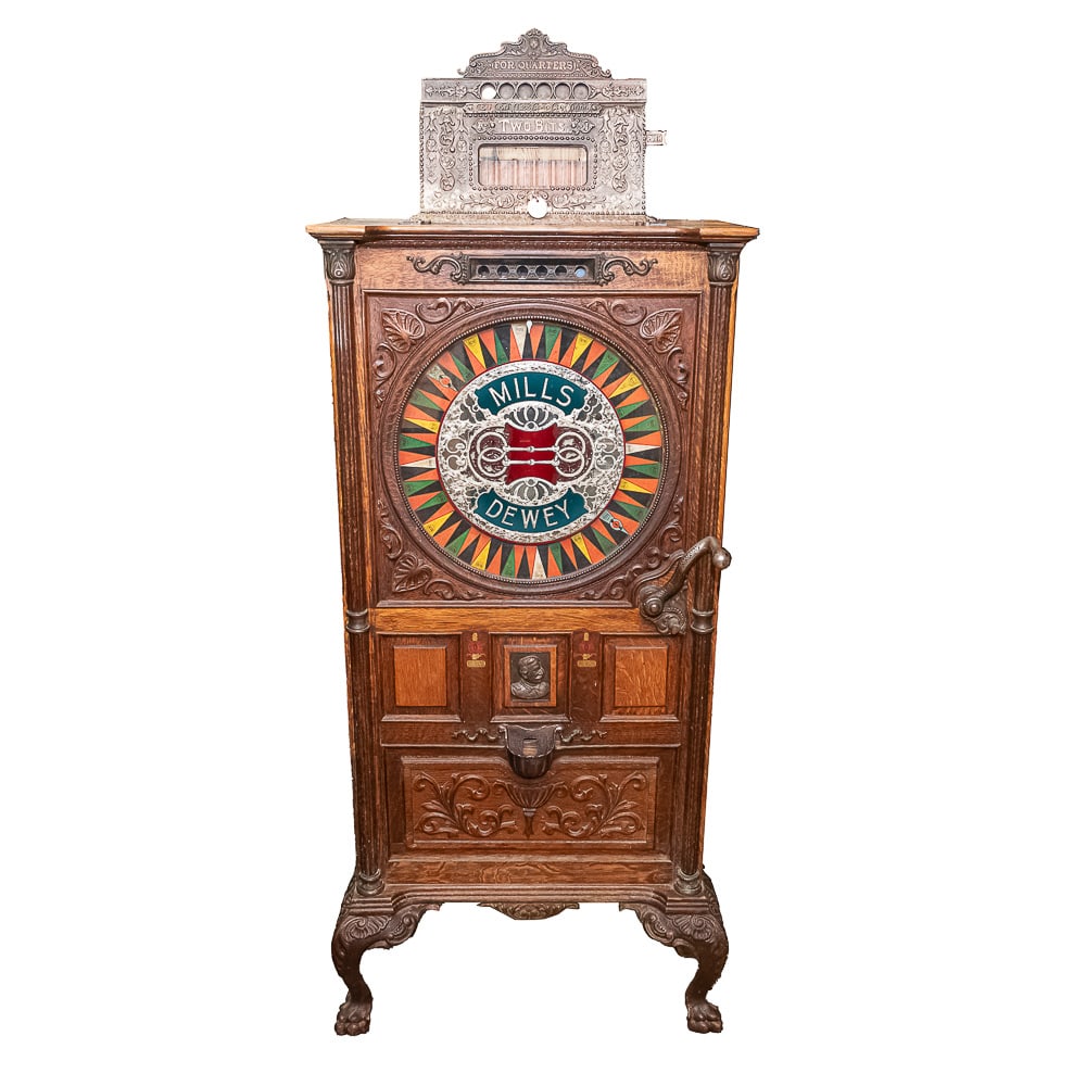 Mills Dewey Two Bit 25c Slot Machine: 100% original Mills Dewey Two Bit. Hard to find in this nice of unmolested original condition. Pays and plays, runs smoothly. Has keys. 13 1/2" L x 25" W x 68" H (to top of coin head)Note: Pickup/Tran