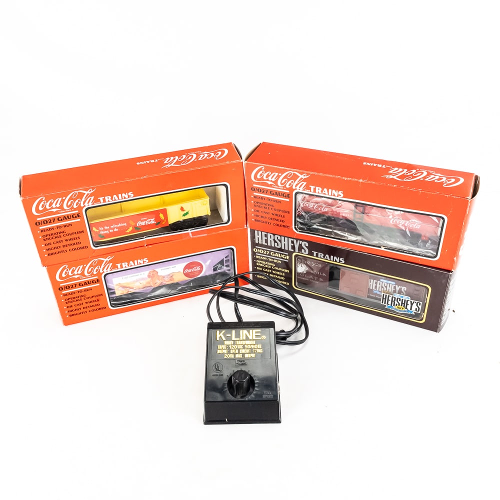 KLine Coke & Hershey's Commemorative Railway Cars: Collection features (3) Kline 1990s assorted Coke railway cars & Hershey's 100th Anniversary boxcar with Kline hobby transformer. Very good overall condition, still featured inside original