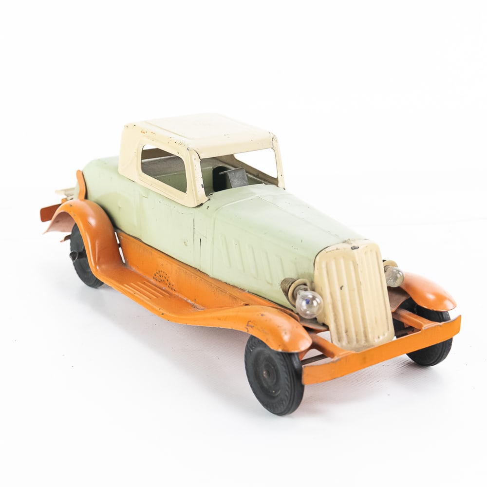 30s Girard Pierce Arrow Wind Up Pressed Steel Car: 1930s Girard Pierce Arrow pressed steel wind up toy car. Good overall condition with age and wear related cosmetic imperfections- including surface scratches, off balance rubber tires. Winds and does