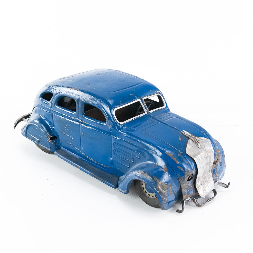 Vintage Louis Marx Pressed Steel Toy Mystery Car: Louis Marx pressed steel toy Mystery Car. Good overall condition with age and wear related cosmetic imperfections- Moderate dings and dents, paint loss & oxidation (missing headlights & front bumper).