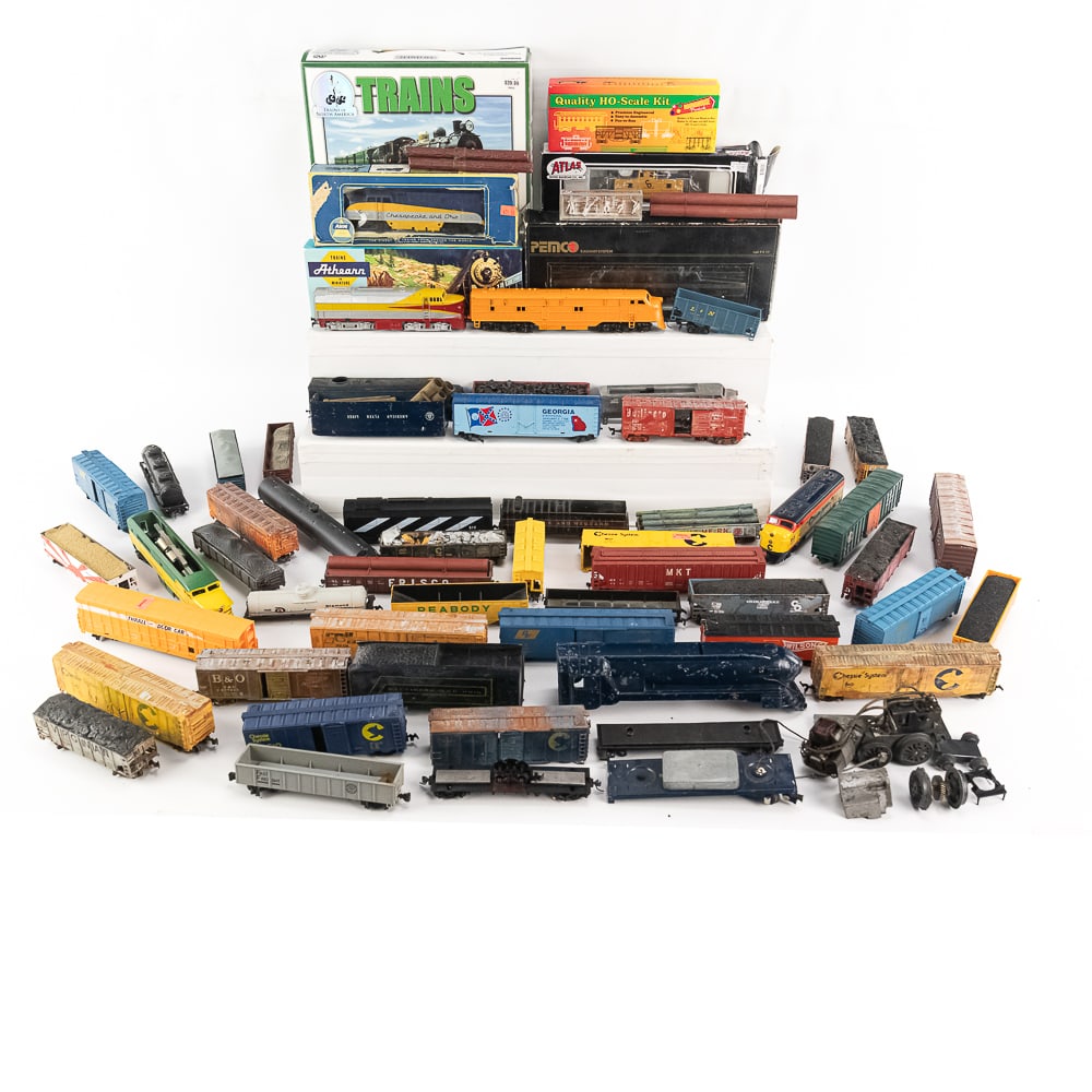 Vintage HO Toy Train Assortment Pemco GG-1 & More+: Vintage HO toy train assortment including Pemco GG1 Pennsylvania electronic locomotive with box; Chesapeake & Ohio Engine, HO scale kit, Atlas C&O Cupola Caboose, Trains 24 DVD Set, Athearn U30C C&O L
