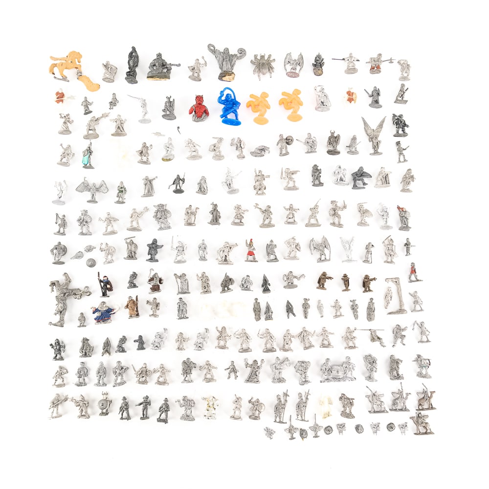 (100 +/-) Dungeons & Dragons Pewter Figurines: Collection of (100 +/-) assorted unpainted Dungeons & Dragons pewter Fighters Clerics and Dwarf figurines (.5"-2"); most stamped RAL PARTHA and the applicable year on the bottom side of its base.