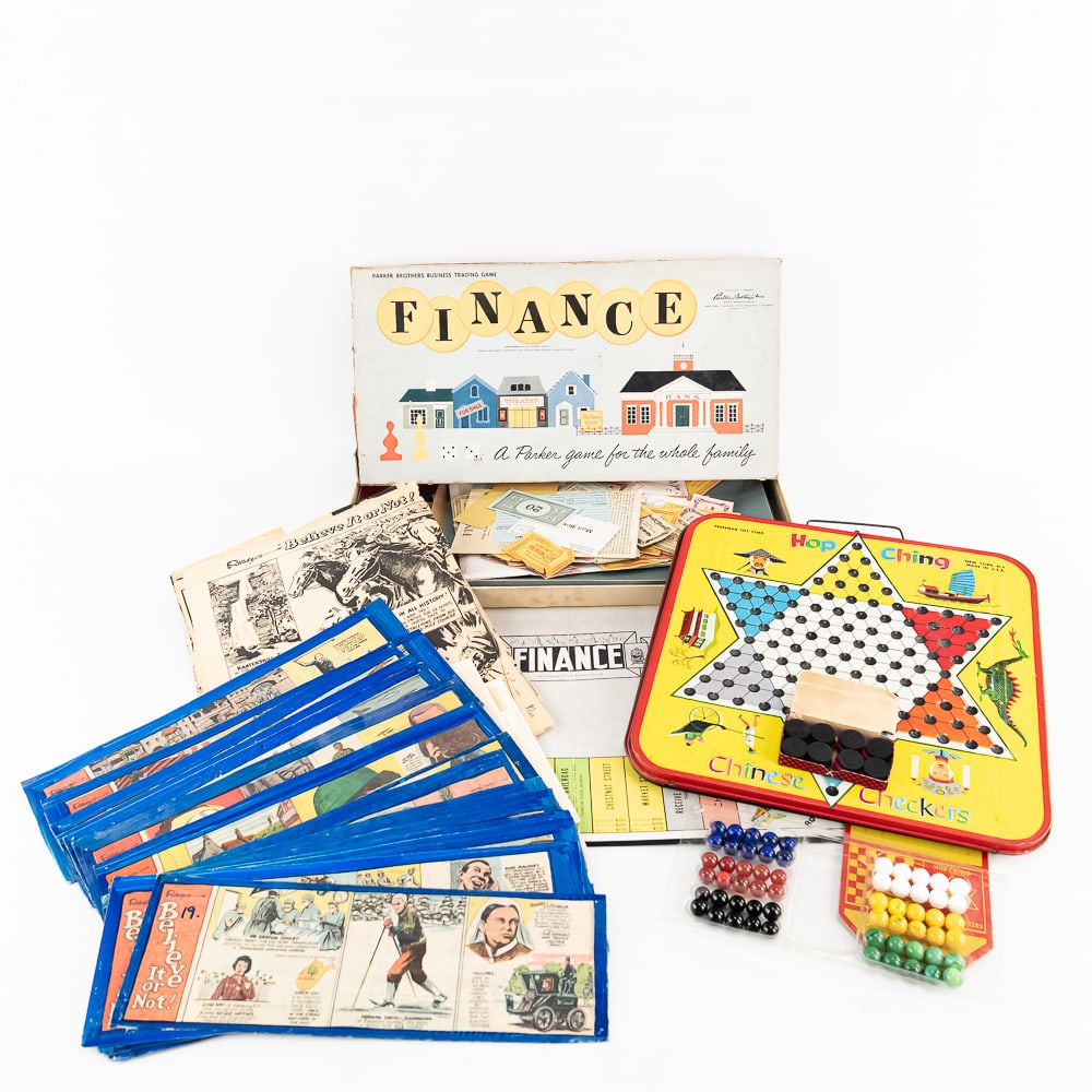 Finance & Ching Chinese Checkers Ripleys Comics: Collection features 1960s Parker Bros "Finance" Board game (appears complete), Freshman Toy Hop Ching Chinese Checkers along with a vintage Ripley's Believe it or Not comic collection on reinforced ba