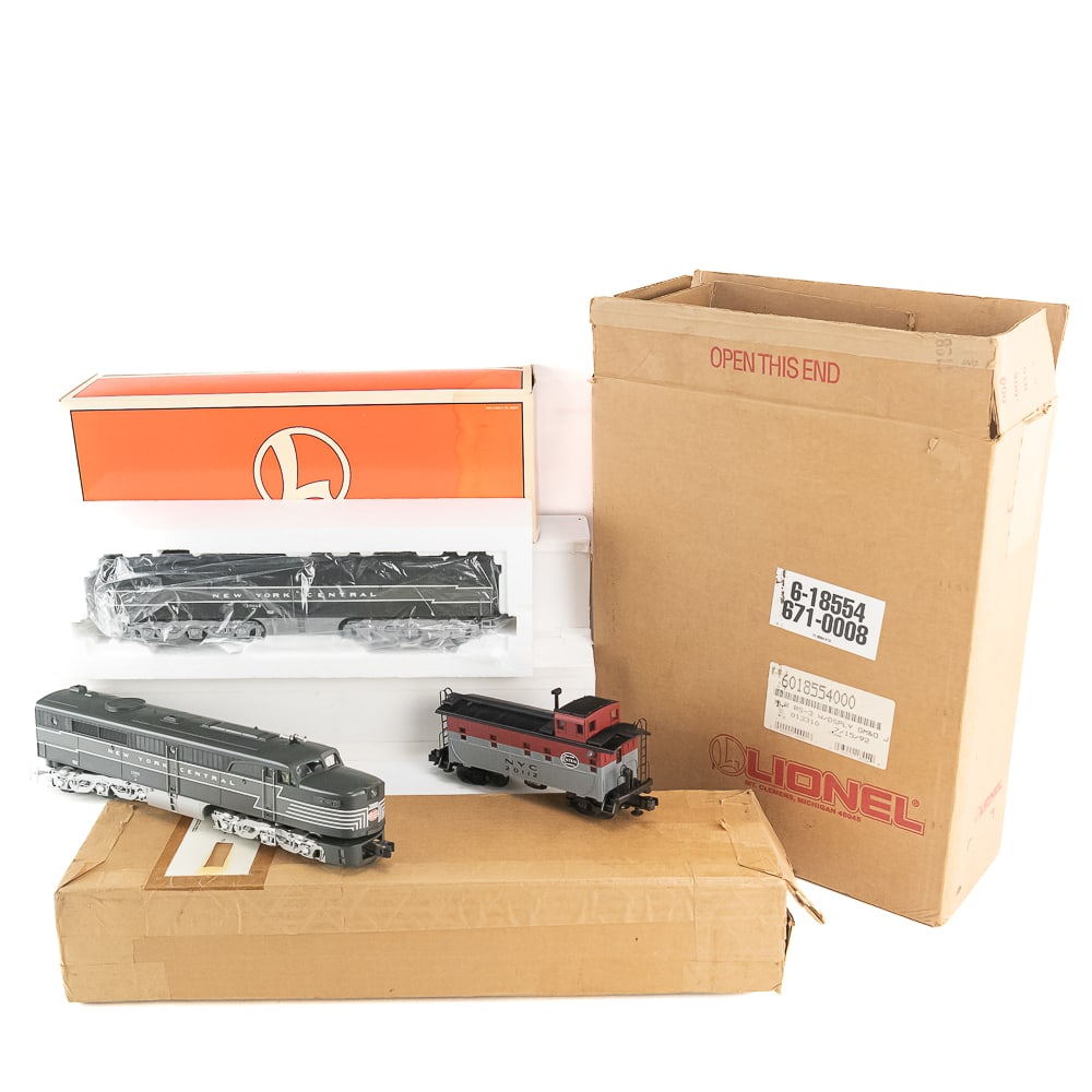 Lionel NYC Diesel Locomotive 2000 Power & Dummy: Collection features Lionel New York Central Alco diesel locomotives with power and without power, One showcased with original box one without original box along with NYC 2011 caboose (no box). Very