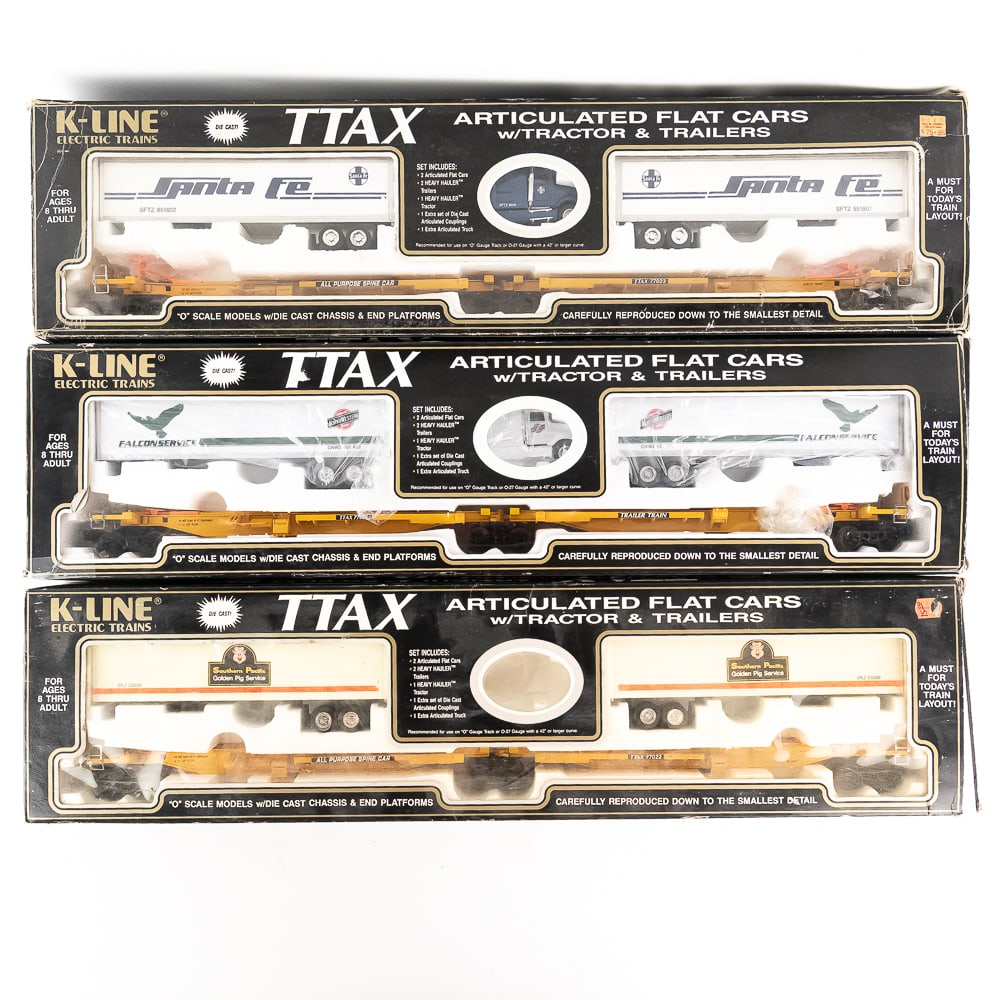 (3) KLINE TTAX Flat Spine Cars w Tractor Trailers: Collection showcases (3) KLINE Die Cast TTAX Articulated Flat Spine Car w Tractor & Trailers sets still featured inside original opened packaging. Very good to good overall condition with minor