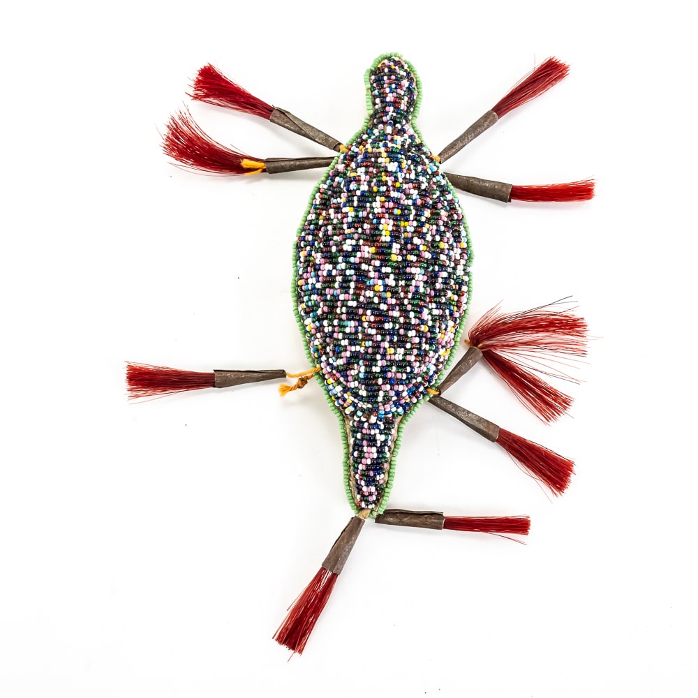 Northern Plains Beaded Turtle Pouch With Horsehair: This striking Plains-style beaded turtle pouch, likely a 20th-century piece, serves as a traditional talisman often used to hold a child's umbilical cord to ensure a long and protected life. The top