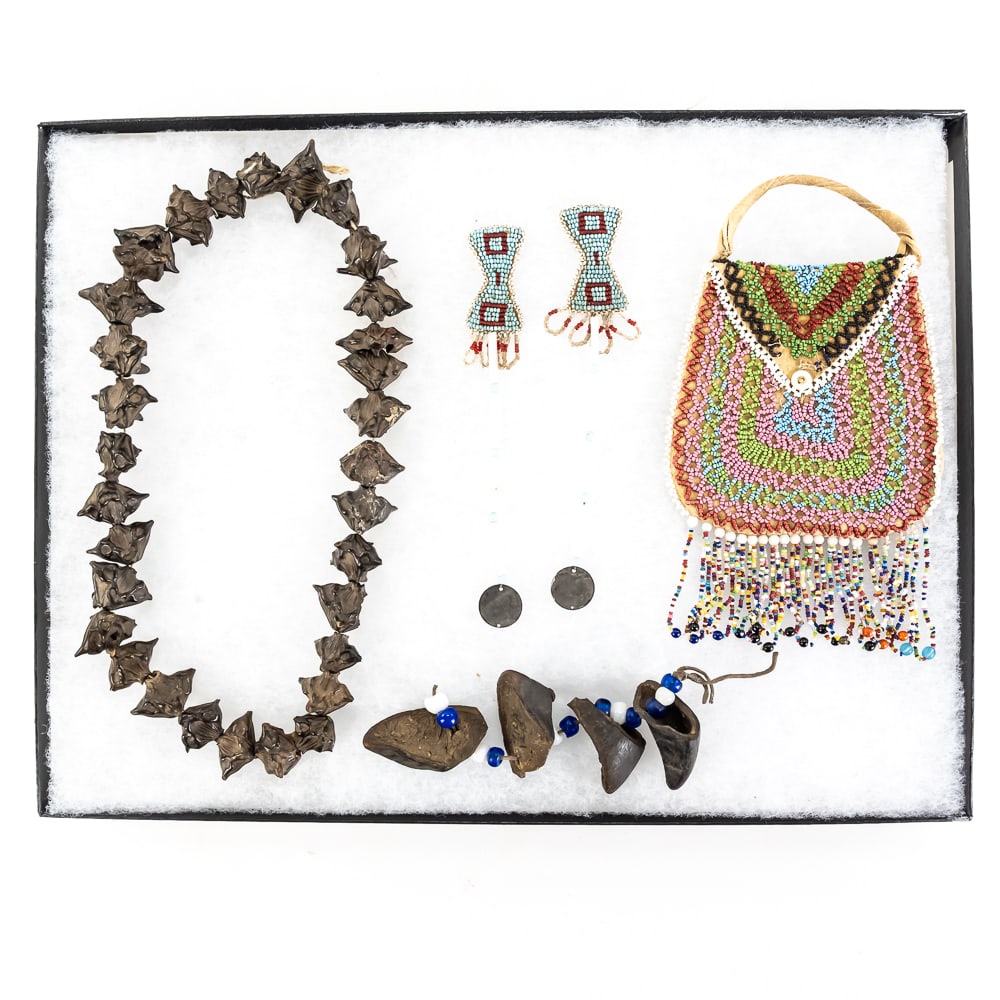 Native American Style Beaded Bag & Items: This collection features a striking Great Lakes or Plateau-style seed bead bag, characterized by its vibrant concentric geometric patterns and long multi-colored fringe. While Great Lakes tribes like