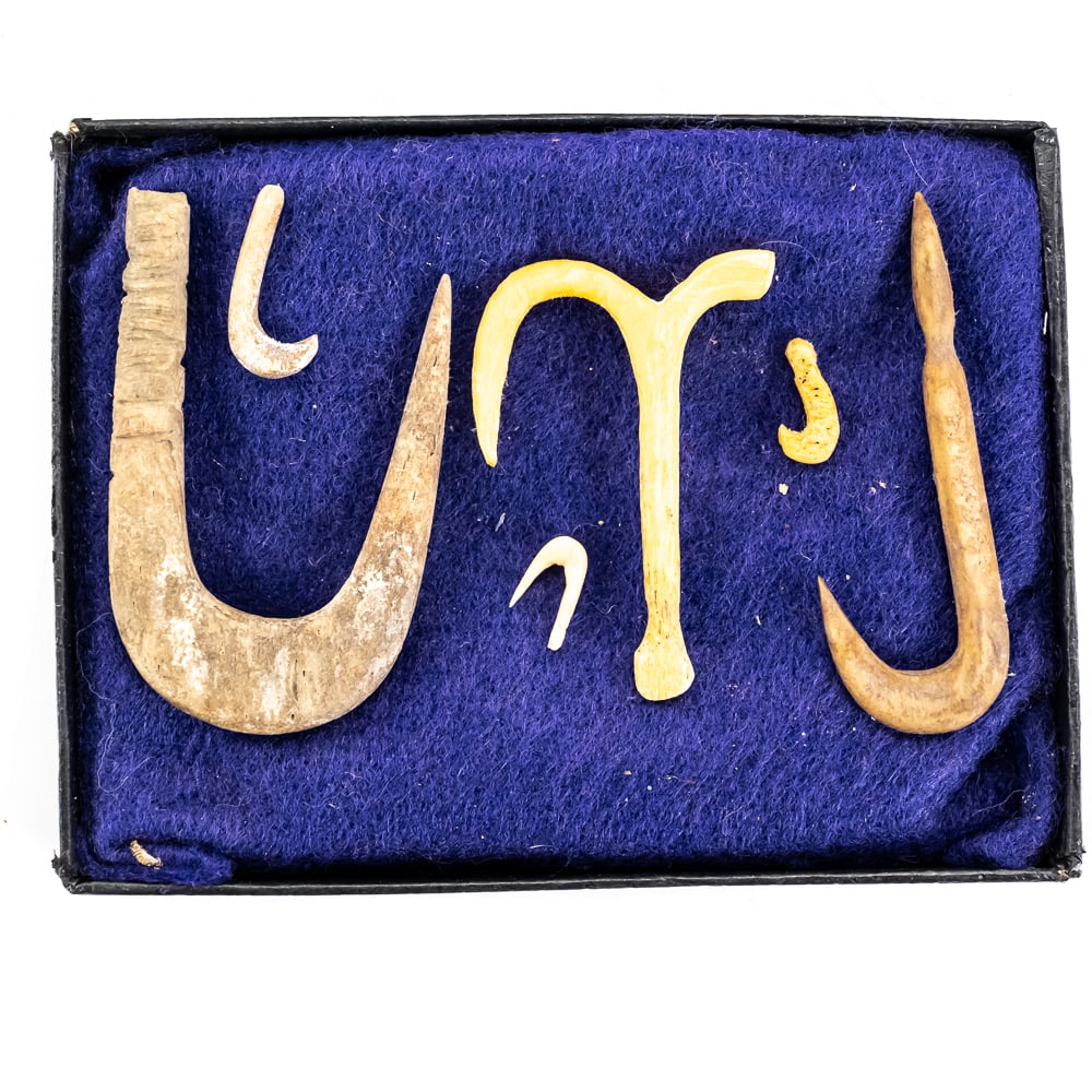 Set of 6 Ancient Style Bone Fish Hooks-*: This intriguing collection features six hand-carved primitive-style fish hooks and a gorge, likely crafted from bone or antler. The set includes a rare double-hook design and various single-barbed