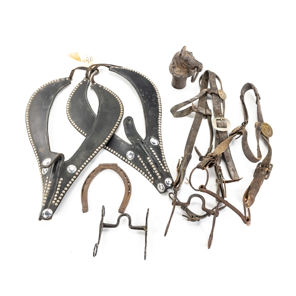 Antique Horse Bits, Bridles & Tack Lot: This diverse collection of vintage equestrian gear features several standout pieces for the seasoned tack collector, including two leather bridles—one adorned with brass heart-shaped rosettes an