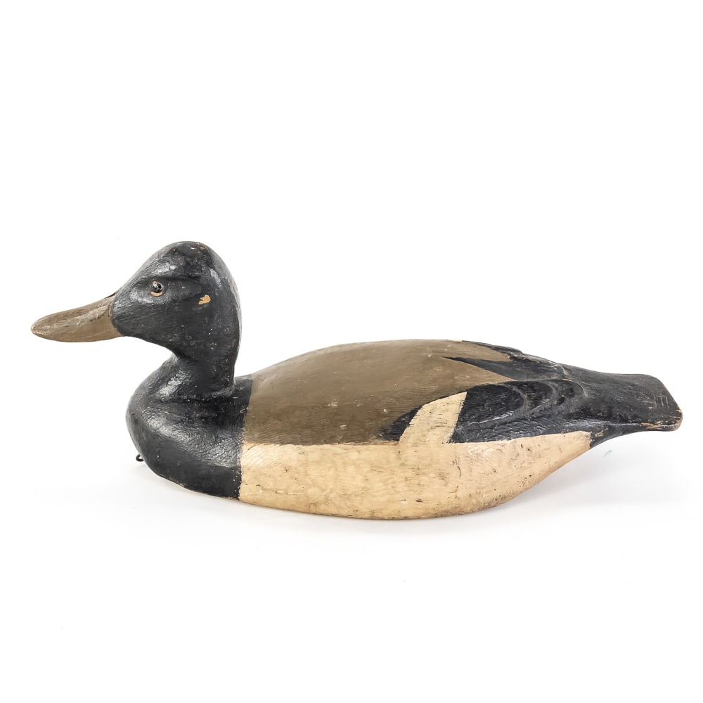 Antique Hand-Carved Wooden Duck Decoy: This mid-century hand-carved wooden duck decoy represents the quintessential "working bird" aesthetic, likely originating from the North American flyway tradition. The piece features a solid wood