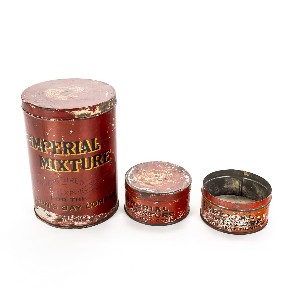 Vintage Hudson's Bay Tobacco Tin Trio: This set of three "Imperial Mixture" tobacco tins was manufactured expressly for the historic Hudson’s Bay Company, featuring their iconic "Pro Pelle Cutem" coat of arms. These vibrant red