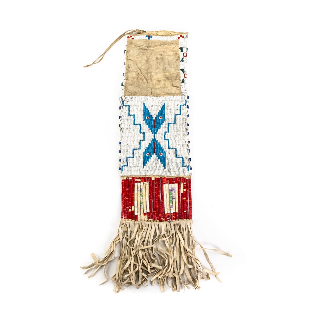 Native American Beaded Plains Pipe Bag: This striking Plains-style pipe bag, likely of Lakota (Sioux) origin and dating to the late 19th or early 20th century, showcases the transition of artistry into the early reservation era. The main bo