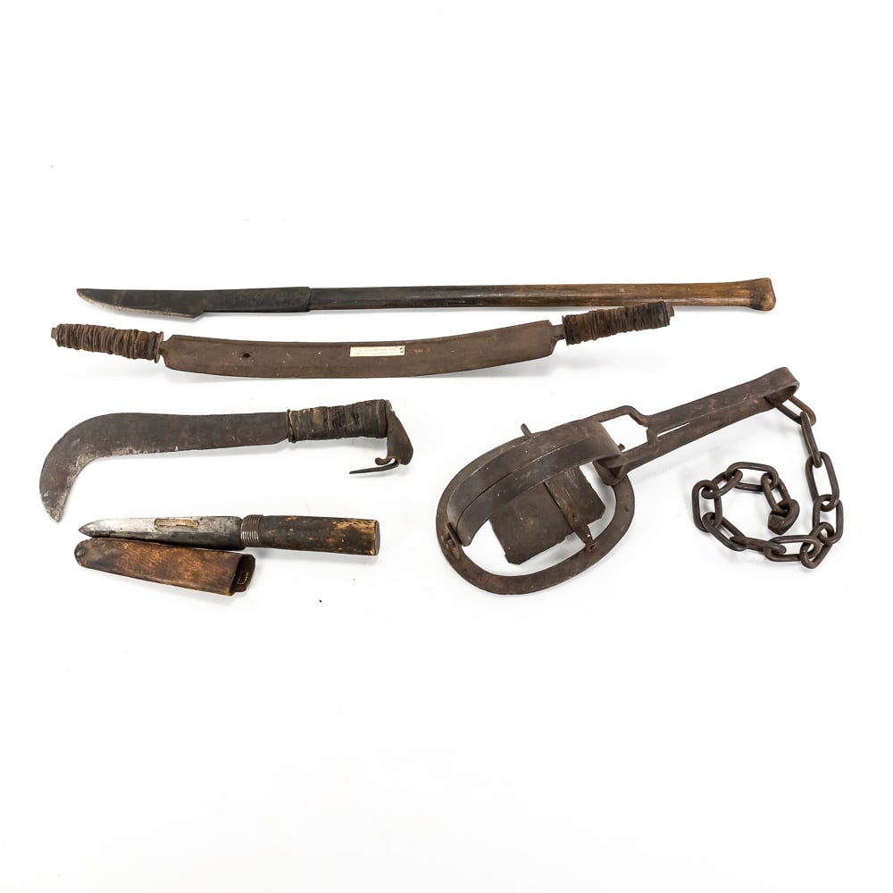 Antique Trapper and Bladesmith Tool Lot: This specialized collection features a rugged assortment of 19th and early 20th-century utility tools, headlined by a Robert Sorby "80" Cast Steel long knife with a distinctive kangaroo or animal touc