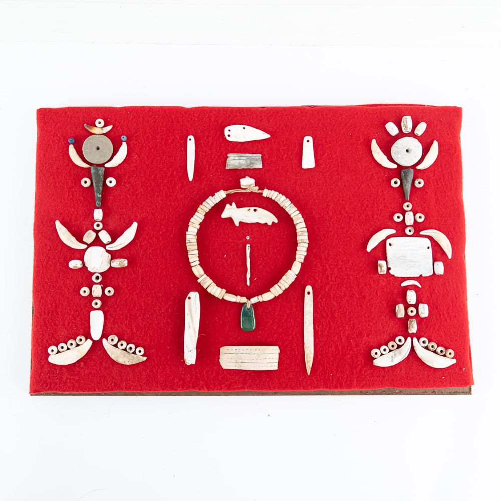 Native American Style Artifact Shadowbox: This impressive shadowbox display features a curated collection of Native American style artifacts, meticulously arranged on a vibrant red felt backing. As a long-time collector of ethnographic art,