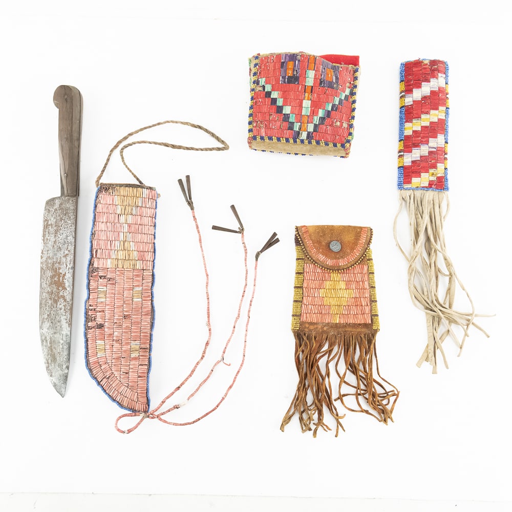 Plains Style Quilled & Beaded 4pc Set: This remarkable collection features four distinct pieces of Plains-style artistry, showcasing traditional quillwork and beadwork on brain-tanned leather. The centerpiece is a substantial trade knife