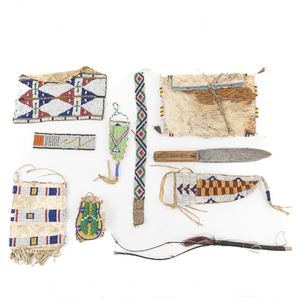 Antique Plains Beaded Buckskin Collection (10): This collection features authentic Plains Indian beadwork, headlined by a magnificent lane-stitched knife scabbard. Expertly crafted on brain-tanned buckskin, the pieces showcase traditional geometric
