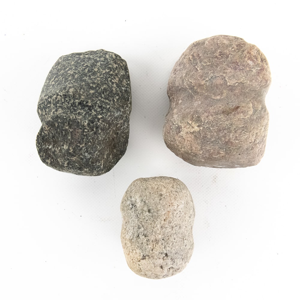 Trio of Native American Grooved Mauls (3): This collection features three authentic prehistoric stone mauls or hammerstones, likely dating from the Archaic to Woodland periods. Each piece is crafted from dense, igneous glacial cobble,