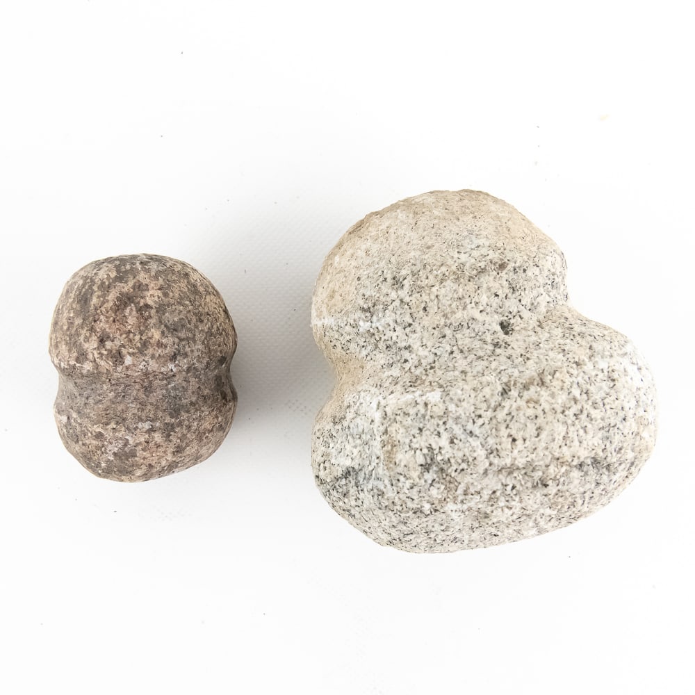 Prehistoric Native American Stone Mauls (2): These artifacts represent the rugged utility of the Archaic to Woodland periods, specifically identified as full-grooved mauls or hammer heads. Crafted from dense, pecked, and ground igneous stone