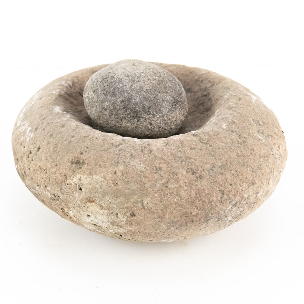 Indigenous Stone Mortar and Pestle Set (2): This classic example of lithic technology features a substantial hand-pecked mortar and a complementary rounded pestle, likely utilized by indigenous peoples for processing maize, seeds, or medicinal