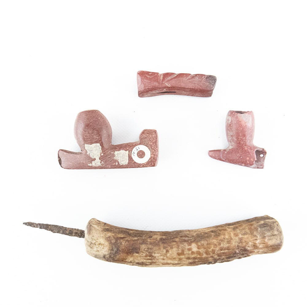 Native American Catlinite Pipe Collection: This select group features three distinct red catlinite (pipestone) pipe components alongside a frontier-era antler awl. The catlinite pieces, synonymous with Great Plains ceremonial traditions,